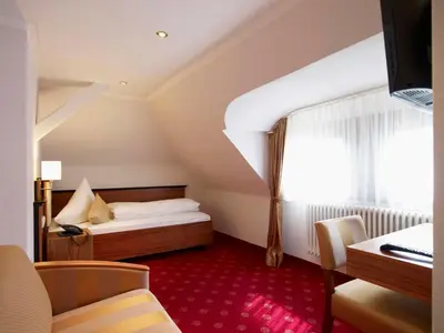 Ein Bett oder Betten in einem Zimmer der Unterkunft Naturhotel Rügers Forstgut