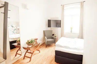 Ein Bett oder Betten in einem Zimmer der Unterkunft Denner Hotel