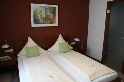Ein Bett oder Betten in einem Zimmer der Unterkunft Hotel-Restaurant 1735