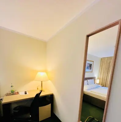 Ein Bett oder Betten in einem Zimmer der Unterkunft Hotel Residenz Stockstadt