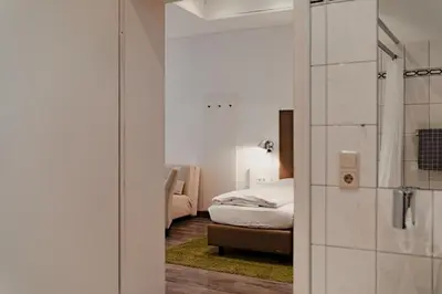 Ein Bett oder Betten in einem Zimmer der Unterkunft Hotel & Gasthaus Backmulde