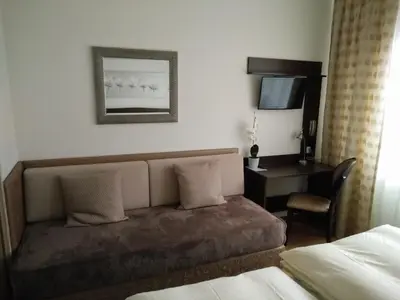 Ein Bett oder Betten in einem Zimmer der Unterkunft Hotel Alfa