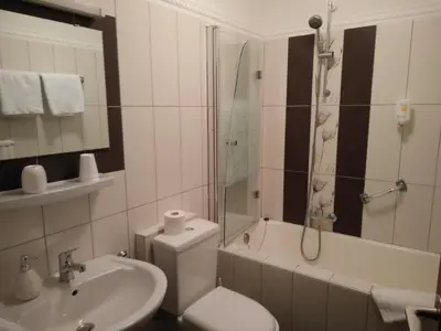 Ein Badezimmer in der Unterkunft Hotel Alfa