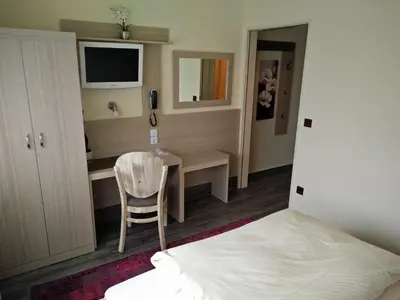Ein Bett oder Betten in einem Zimmer der Unterkunft Hotel Alfa