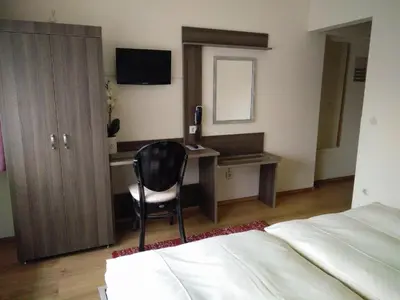 Ein Bett oder Betten in einem Zimmer der Unterkunft Hotel Alfa