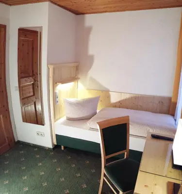 Ein Bett oder Betten in einem Zimmer der Unterkunft Gasthaus Zur Ölmühle