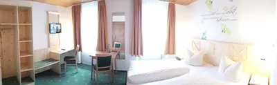 Ein Bett oder Betten in einem Zimmer der Unterkunft Gasthaus Zur Ölmühle