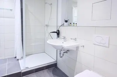 Ein Badezimmer in der Unterkunft Hotel Villa-Bassermann, stilvoll, 2 Min zum Schloss, schnelles WLAN & Parkplatz