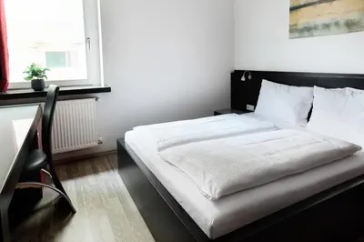 Ein Bett oder Betten in einem Zimmer der Unterkunft Hotel Villa-Bassermann, stilvoll, 2 Min zum Schloss, schnelles WLAN & Parkplatz
