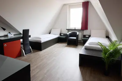 Ein Bett oder Betten in einem Zimmer der Unterkunft Hotel Villa-Bassermann, stilvoll, 2 Min zum Schloss, schnelles WLAN & Parkplatz