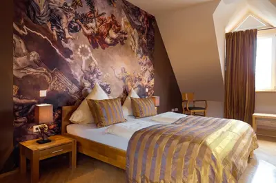 Ein Bett oder Betten in einem Zimmer der Unterkunft Landhotel Hauer
