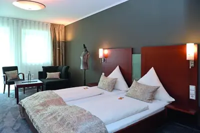 Ein Bett oder Betten in einem Zimmer der Unterkunft Landhotel Hauer