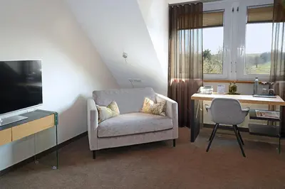 Ein Sitzbereich in der Unterkunft Landhotel Hauer
