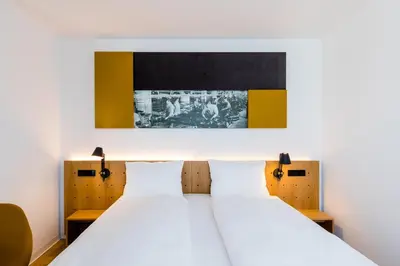 Ein Bett oder Betten in einem Zimmer der Unterkunft mk | hotel rüsselsheim