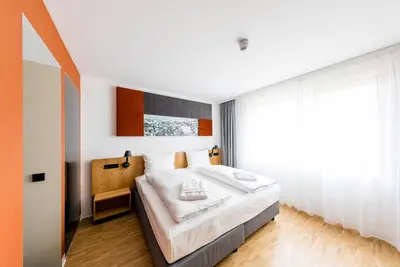 Ein Bett oder Betten in einem Zimmer der Unterkunft mk | hotel rüsselsheim
