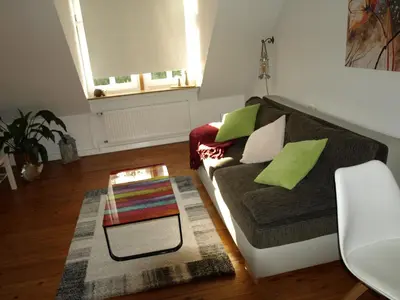 Ein Sitzbereich in der Unterkunft Ferienwohnung Klatschmohn