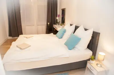Ein Bett oder Betten in einem Zimmer der Unterkunft Apartment Haus Heidelberg