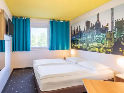 Ein Bett oder Betten in einem Zimmer der Unterkunft B&B Hotel Ludwigshafen