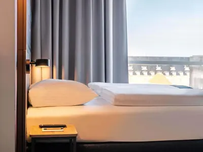 Ein Bett oder Betten in einem Zimmer der Unterkunft B&B Hotel Ludwigshafen