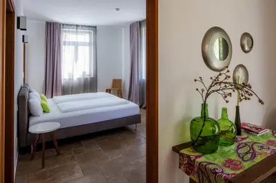 Ein Bett oder Betten in einem Zimmer der Unterkunft Loblocher Hof