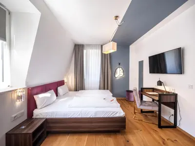 Ein Bett oder Betten in einem Zimmer der Unterkunft acor Boutique Hotel