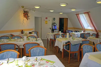 Ein Restaurant oder anderes Speiselokal in der Unterkunft City Hotel Mark Michelstadt