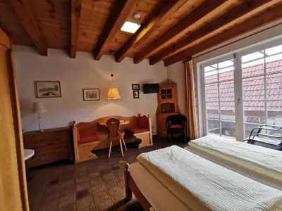 Ein Bett oder Betten in einem Zimmer der Unterkunft Gästehaus im Malerwinkel-Rhodt