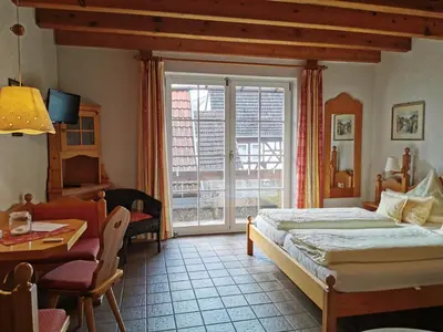 Ein Bett oder Betten in einem Zimmer der Unterkunft Gästehaus im Malerwinkel-Rhodt