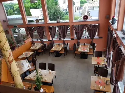 Ein Restaurant oder anderes Speiselokal in der Unterkunft Sunny´s Hotel & Residence