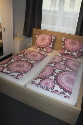 Ein Bett oder Betten in einem Zimmer der Unterkunft Bismarck Hostel Öhringen