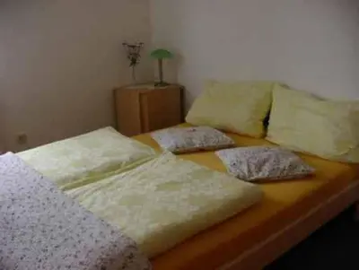 Ein Bett oder Betten in einem Zimmer der Unterkunft Gästehaus Eichwald