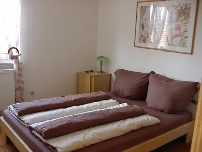 Ein Bett oder Betten in einem Zimmer der Unterkunft Gästehaus Eichwald