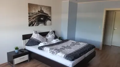 Ein Bett oder Betten in einem Zimmer der Unterkunft FeWo Lingenfeld