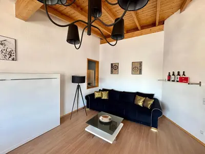 Ein Sitzbereich in der Unterkunft Ferienhaus Event Haus EMG Hockenheim für Familien und Gruppen bis 22 Personen mit Partyraum