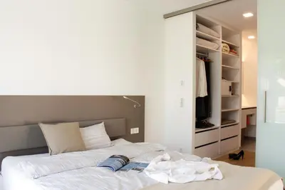 Ein Bett oder Betten in einem Zimmer der Unterkunft Lumina Apartments