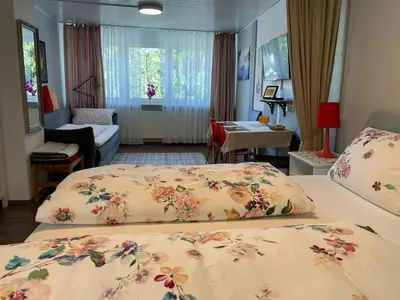 Ein Bett oder Betten in einem Zimmer der Unterkunft Am Berggarten