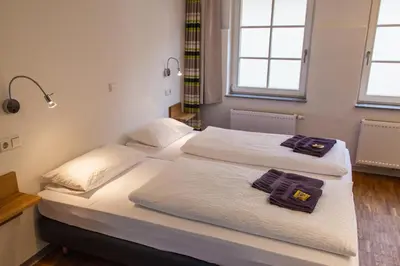 Ein Bett oder Betten in einem Zimmer der Unterkunft Apart-Hotel Heiligenthaler Hof
