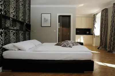 Ein Bett oder Betten in einem Zimmer der Unterkunft Apart-Hotel Heiligenthaler Hof