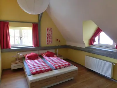 Ein Bett oder Betten in einem Zimmer der Unterkunft Ferienhaus Cartoonwerkstatt
