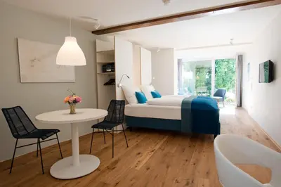 Ein Bett oder Betten in einem Zimmer der Unterkunft 1463 Apartmenthaus