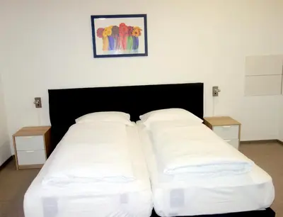 Ein Bett oder Betten in einem Zimmer der Unterkunft Budget Hotel Ludwigshafen