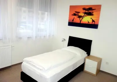 Ein Bett oder Betten in einem Zimmer der Unterkunft Budget Hotel Ludwigshafen