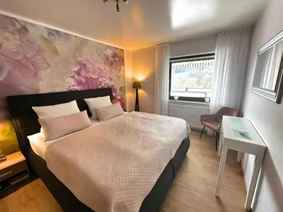 Ein Bett oder Betten in einem Zimmer der Unterkunft Wellness Ferienwohnung Szymecki- Sauna & Whirpool bei Heidelberg