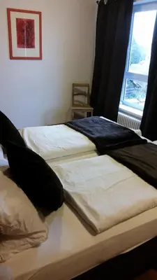 Ein Bett oder Betten in einem Zimmer der Unterkunft Ellenbergs Restaurant & Hotel