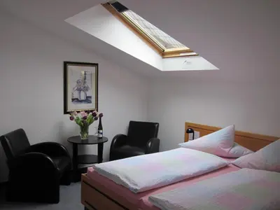 Ein Bett oder Betten in einem Zimmer der Unterkunft Hotel Anlage Heidelberg