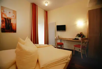 Ein Bett oder Betten in einem Zimmer der Unterkunft Hotel Hoepfner Burghof