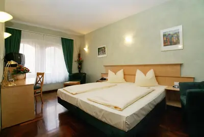 Ein Bett oder Betten in einem Zimmer der Unterkunft Hotel Hoepfner Burghof