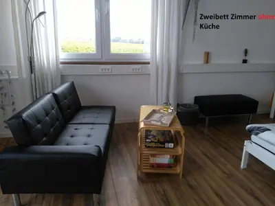 Ein Sitzbereich in der Unterkunft Gästehaus Schumann