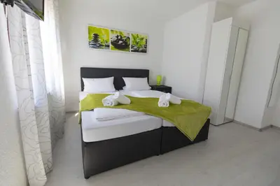 Ein Bett oder Betten in einem Zimmer der Unterkunft Hotel Berlin