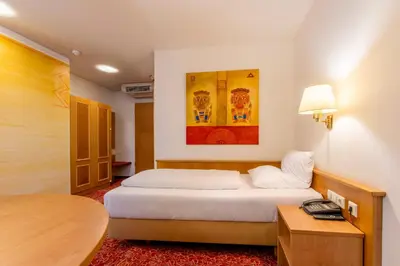 Ein Bett oder Betten in einem Zimmer der Unterkunft ALLVITALIS Traumhotel